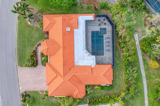 a living room with fireplace furniture and a large window