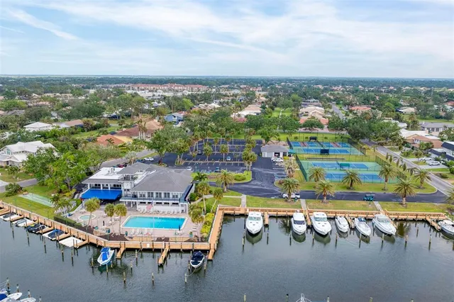 a view of a livingroom with furniture and a book shelf