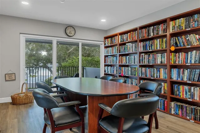 a blue sign that is sitting in the middle of a yard