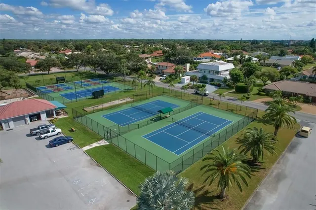a view of a house with patio and a yard
