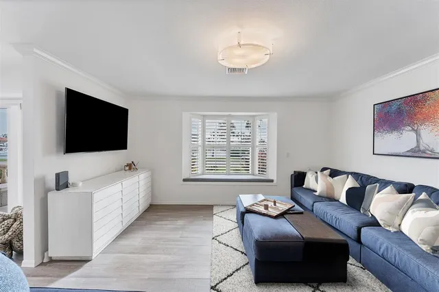 a kitchen with granite countertop white cabinets a stove and a granite counter top