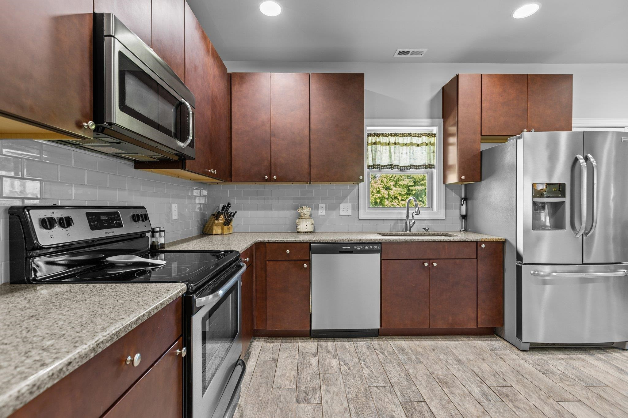 312 P G Pearce Road Zebulon, NC 27597 - Photo 18 of 57 Quartz Countertops & Tile Backsplash
