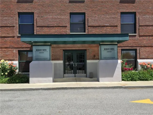 a front view of a building with garden