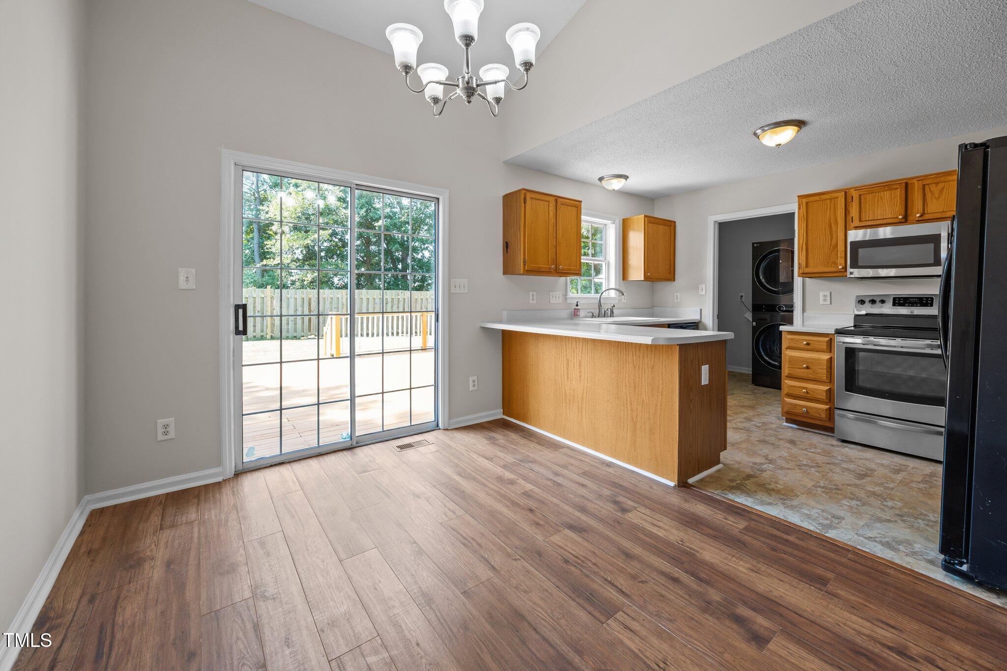 408 Flagg Road Holly Springs, NC 27540 - Photo 11 of 32 a view of an empty room with a window