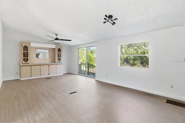 a view of an empty room with a window