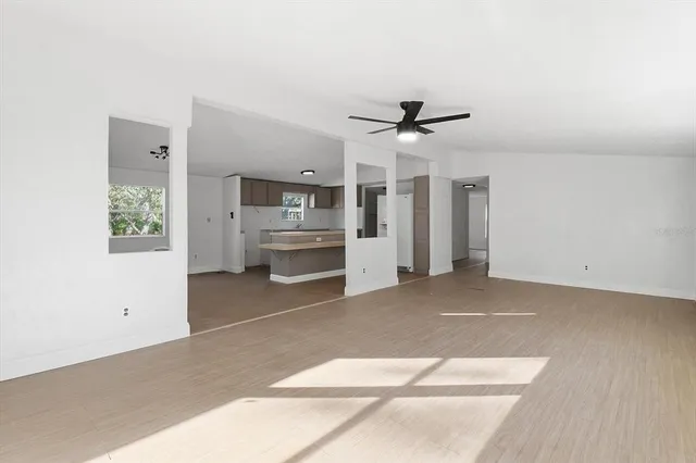 a view of a kitchen with a sink and a refrigerator
