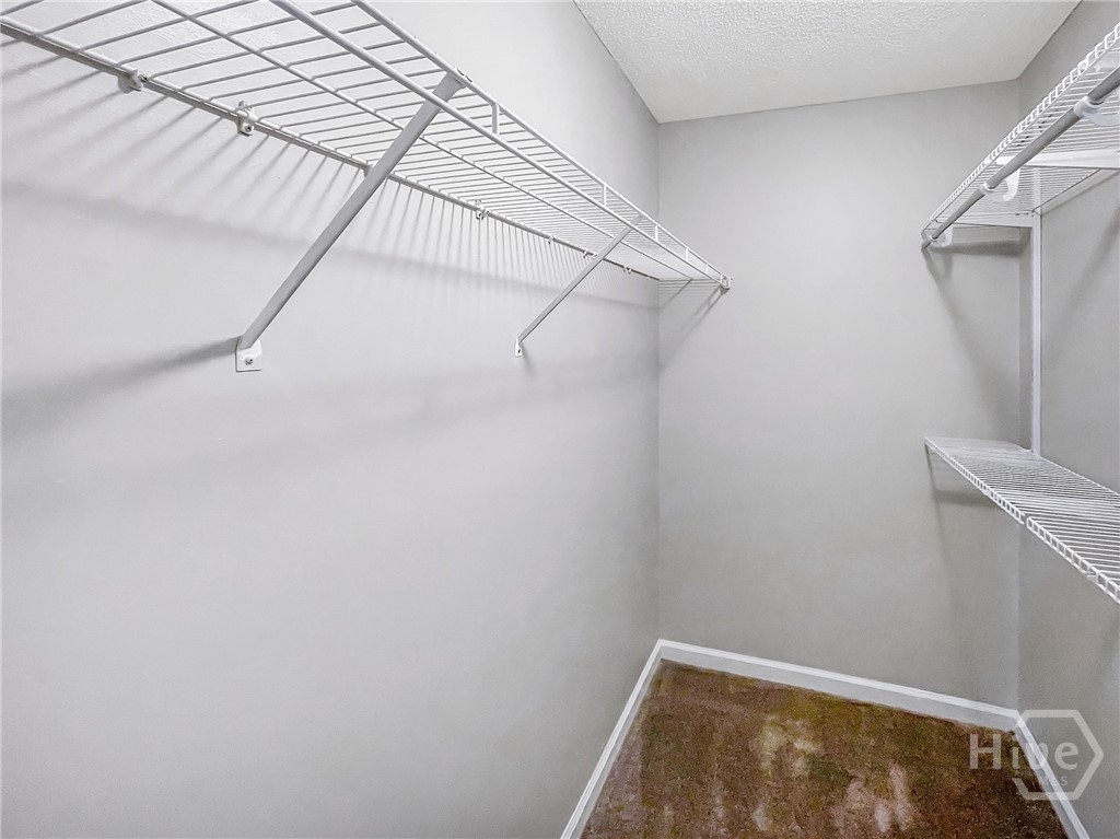 251 Autumn Ridge Court Gray, GA 31032 - Photo 19 of 31 Walk-in Closet in Primary Bedroom