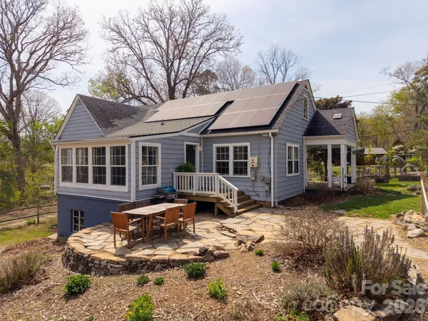 a front view of a house with yard porch and furniture