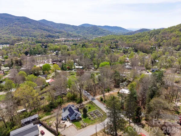 an aerial view of residential house and green space