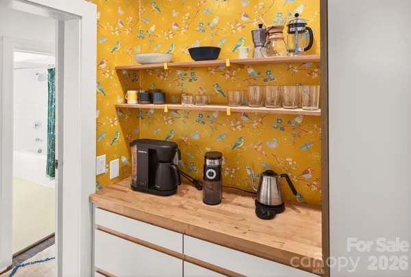 a kitchen with a sink and potted plant