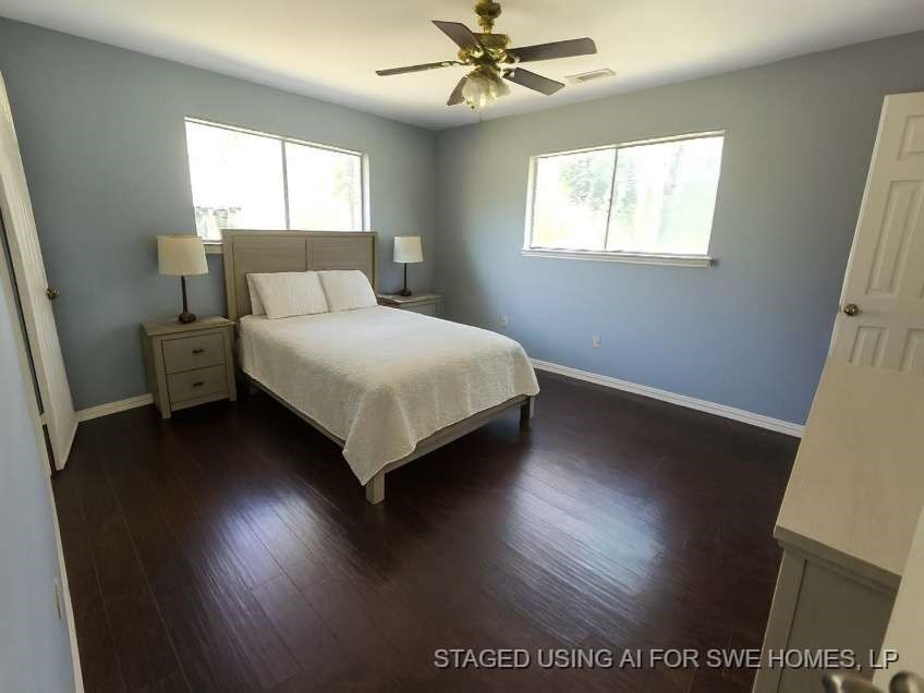 509 Bobcat Lane Daisetta, TX 77533 - Photo 9 of 13 a bed sitting in a bedroom next to a window