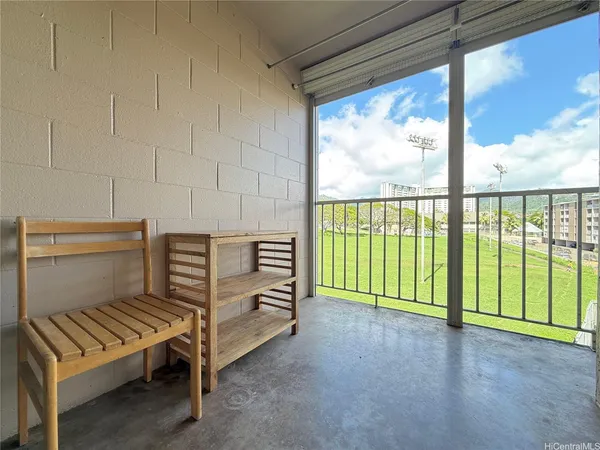 a view of a room with stairs and a floor to ceiling window