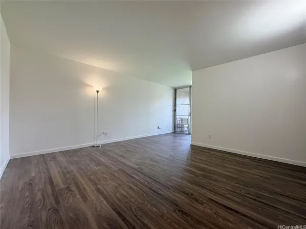 an empty room with wooden floor