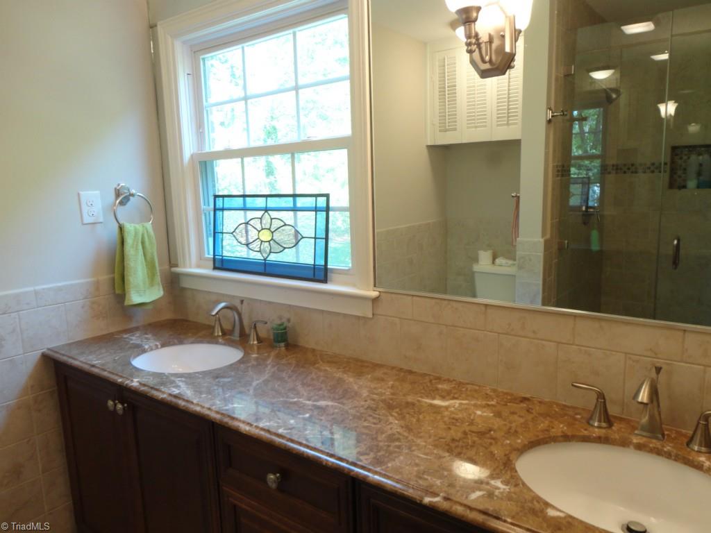 1420 Heathcliff Road High Point, NC 27262 - Photo 16 of 29 Master Bath with walk-in tile shower reflected in mirror