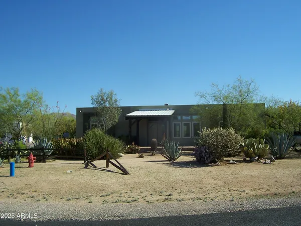 a view of a backyard with sitting area
