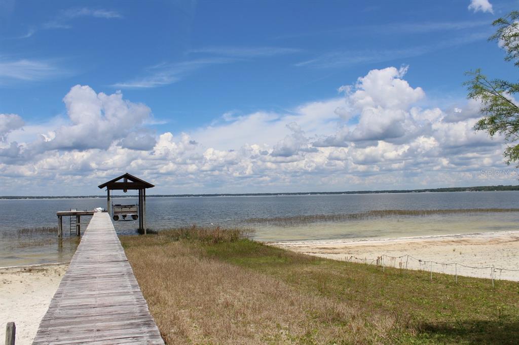 12595 Southeast Sunset Harbor Road Weirsdale, FL 32195 - Photo 24 of 25 a view of entryway with sky view