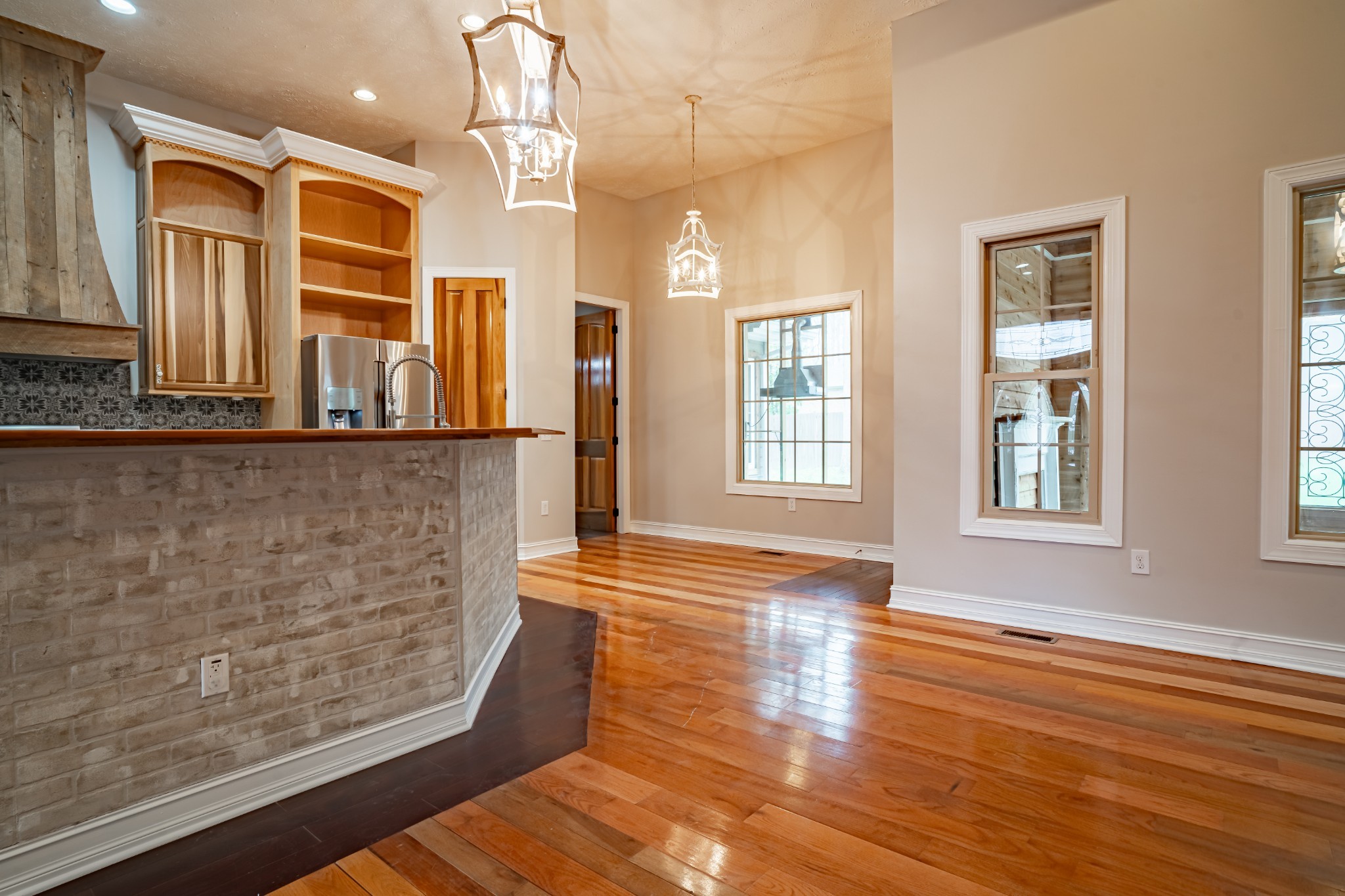 550 Laurel Crown Road Manchester, TN 37355 - Photo 49 of 87 a view of a living room with wooden floor and chandelier