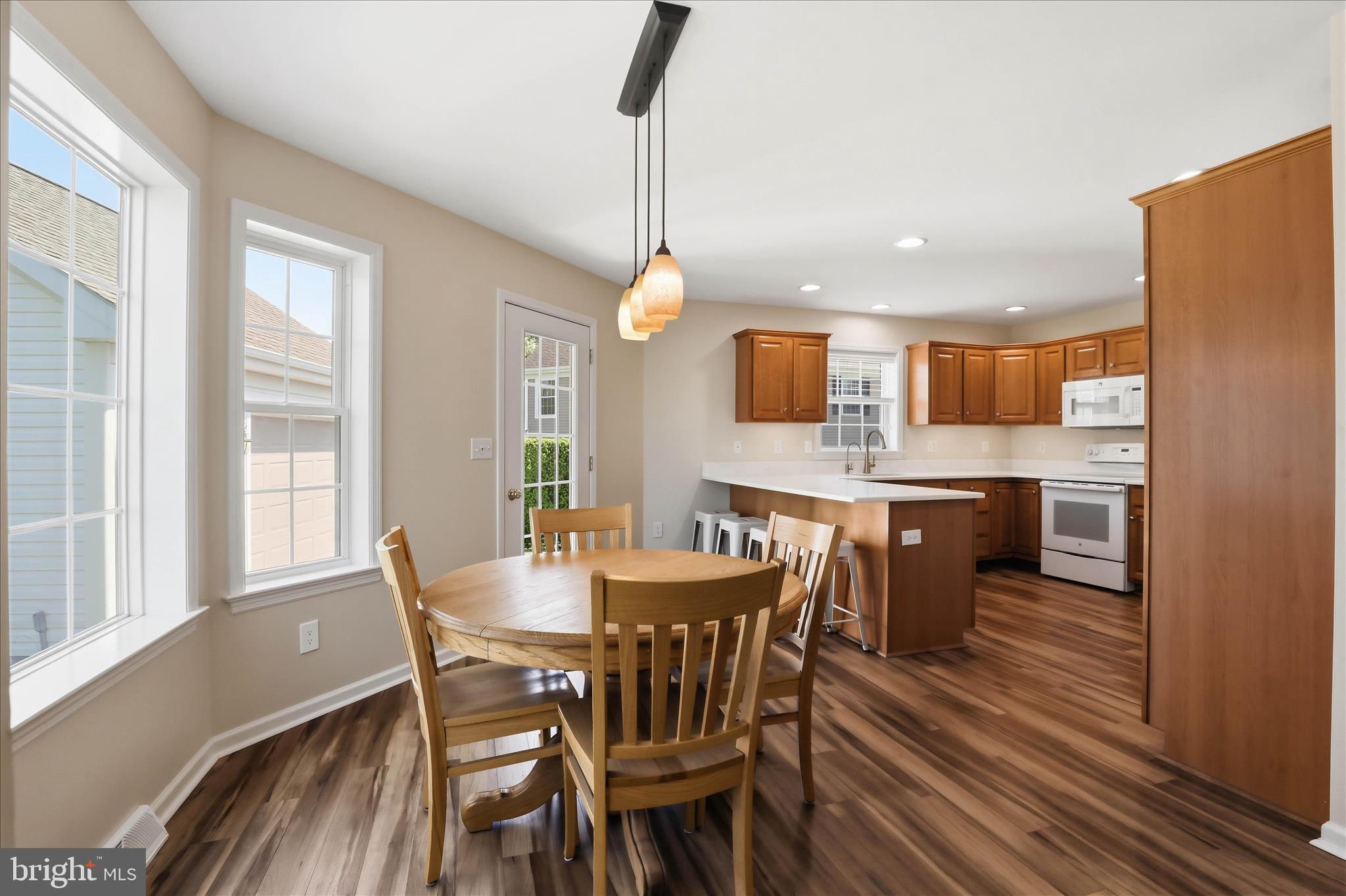 533 Thornberry Lane Lititz, PA 17543 - Photo 11 of 56 a view of a dining room with furniture window and wooden floor