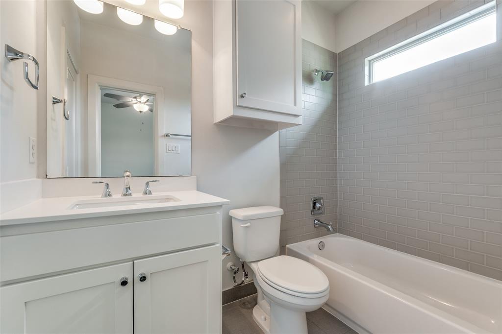 5830 Oram Street, Unit 5 Dallas, TX 75206 - Photo 8 of 18 a bathroom with a sink a toilet and shower