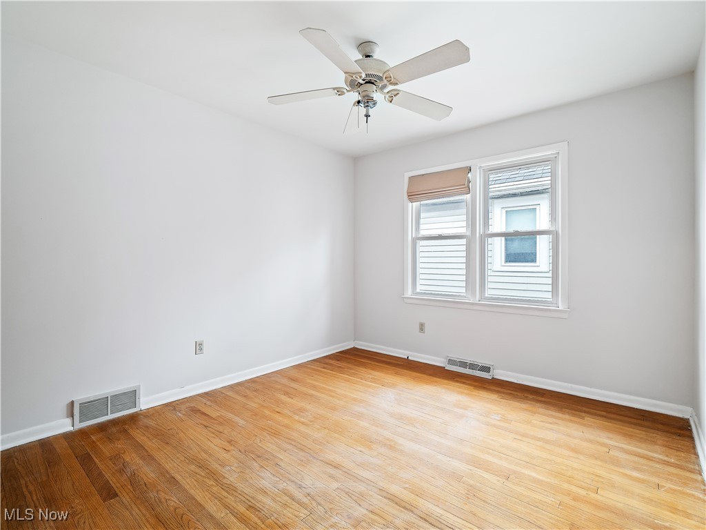 23812 Knickerbocker Road Bay Village, OH 44140 - Photo 16 of 31 Empty room with ceiling fan and light hardwood / wood-style floors