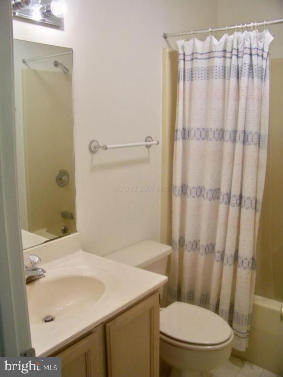 28 Battersea Road Ocean Pines, MD 21811 - Photo 14 of 17 a bathroom with a sink toilet and shower