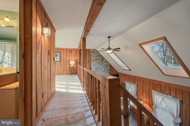 a view of a hallway with stairs