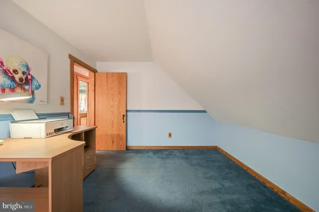 a view of an empty room with a large window