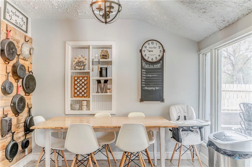 455 River Bend Road Southwest Plainville, GA 30733 - Photo 12 of 59 a view of a dining room with furniture window and wooden floor