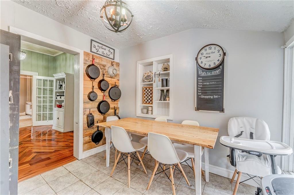 455 River Bend Road Southwest Plainville, GA 30733 - Photo 13 of 59 a view of a dining room with furniture and a large window