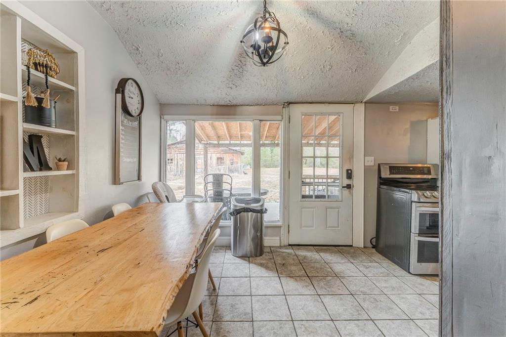 455 River Bend Road Southwest Plainville, GA 30733 - Photo 15 of 59 a spacious bathroom with a granite countertop double vanity sink and bathtub