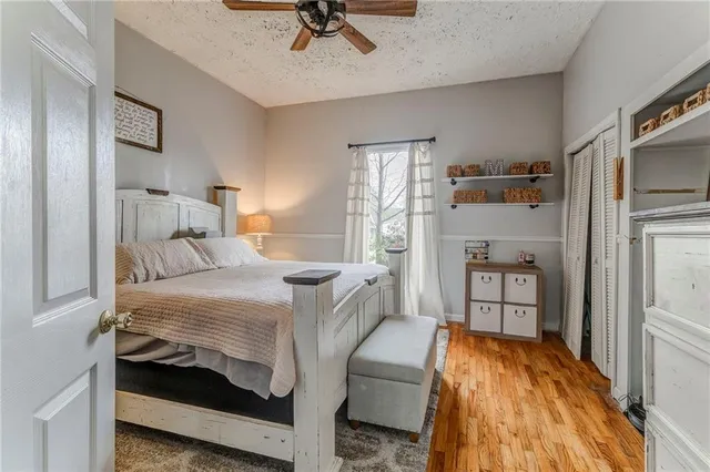 a bedroom with furniture and a mirror