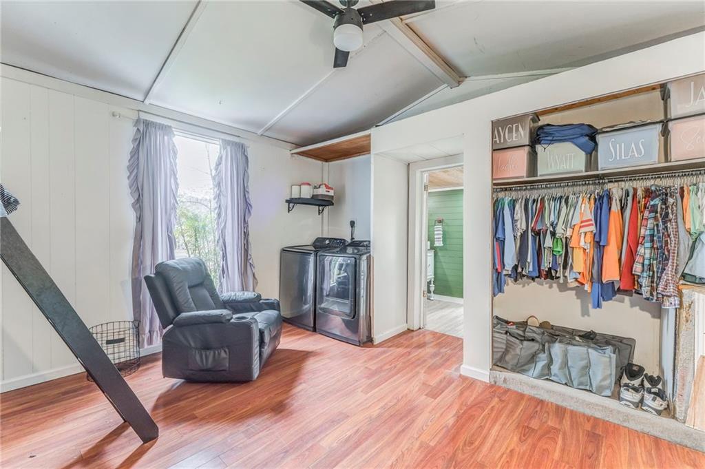 455 River Bend Road Southwest Plainville, GA 30733 - Photo 23 of 59 a living room with furniture a flat screen tv and a large window