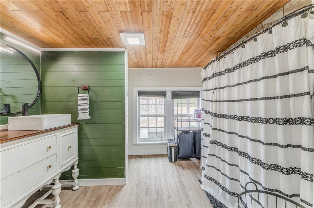 455 River Bend Road Southwest Plainville, GA 30733 - Photo 26 of 59 a bathroom with a sink and a mirror