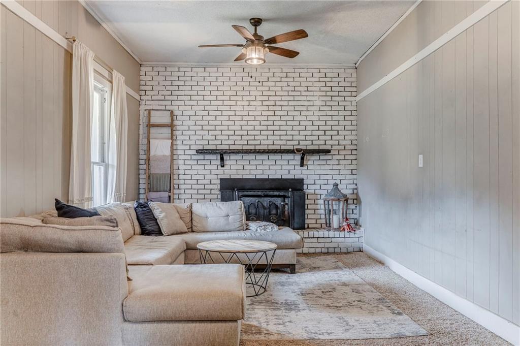 455 River Bend Road Southwest Plainville, GA 30733 - Photo 36 of 59 a living room with furniture and a fireplace