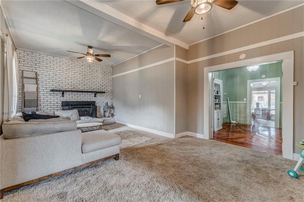 455 River Bend Road Southwest Plainville, GA 30733 - Photo 37 of 59 a living room with furniture and a fireplace