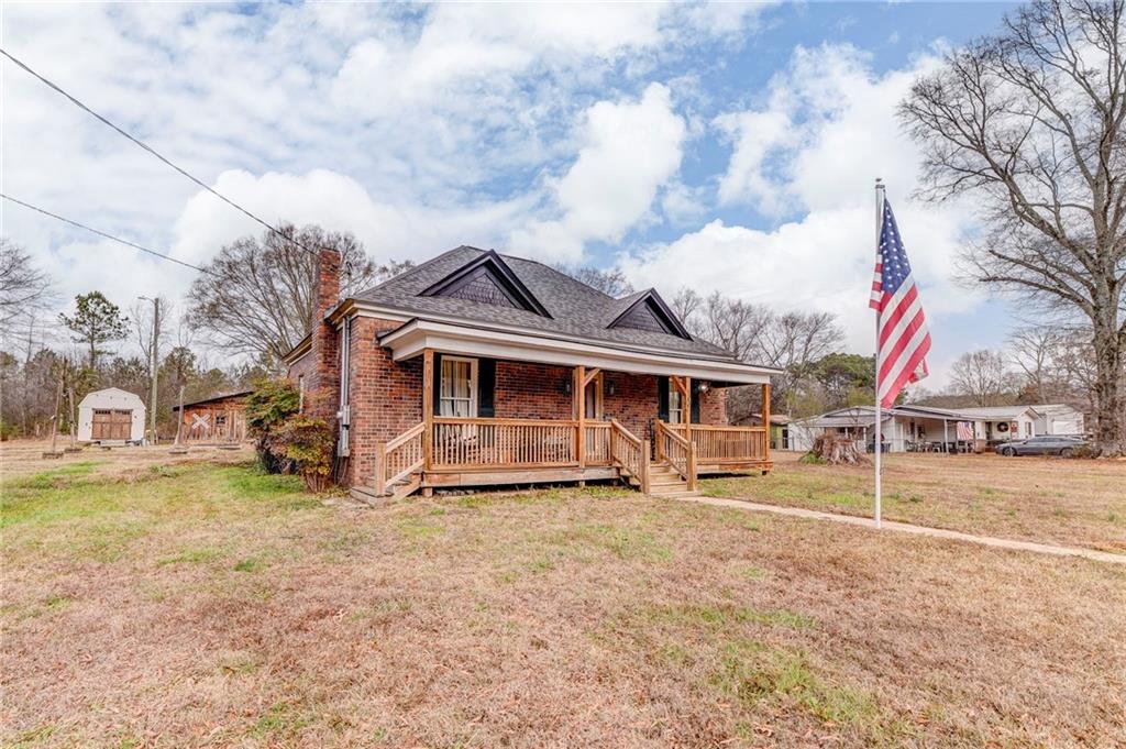 455 River Bend Road Southwest Plainville, GA 30733 - Photo 49 of 59 a view of a house with a big yard and large trees