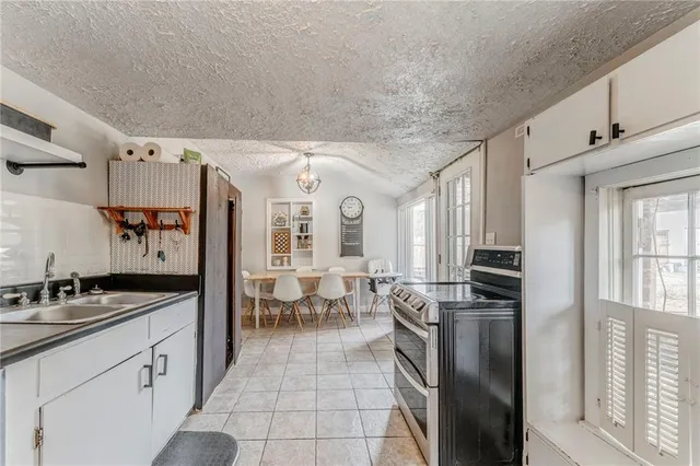 a view of a dining room with furniture and a large window