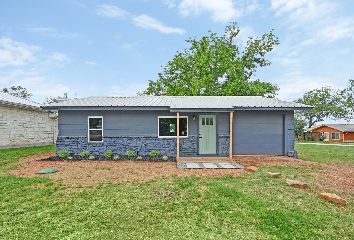 front view of house with a yard
