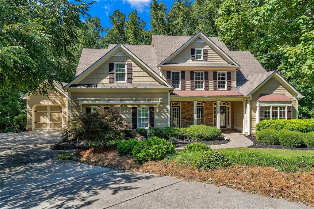 406 Maple Ridge Court Cumming, GA 30028 - Photo 1 of 1 a front view of a house with garden