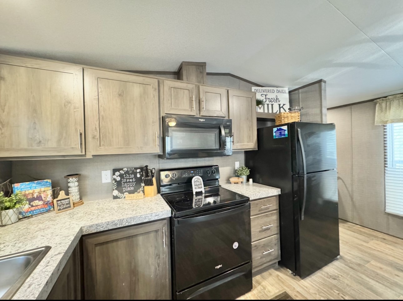 1575 County Rd B Lexington, TX 78947 - Photo 11 of 35 a kitchen with stainless steel appliances granite countertop a refrigerator sink and stove