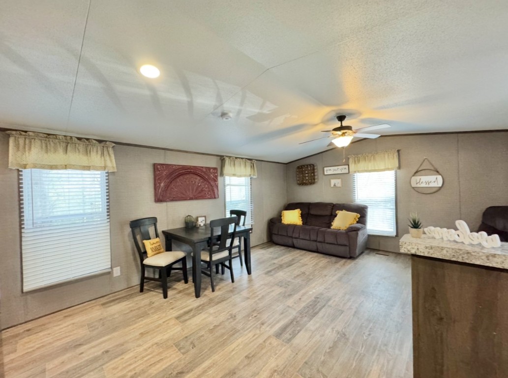 1575 County Rd B Lexington, TX 78947 - Photo 12 of 35 a living room with furniture and wooden floor