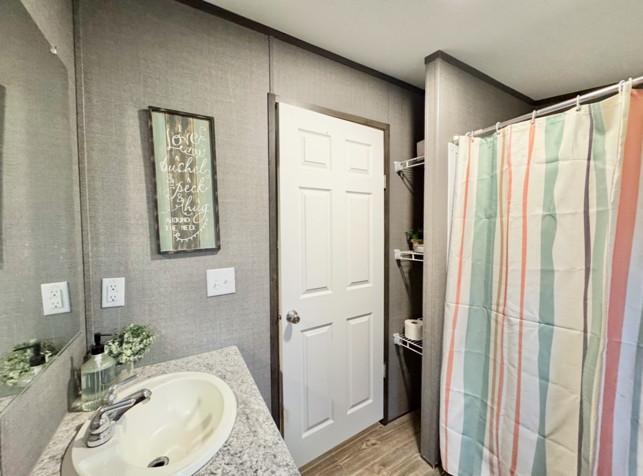 1575 County Rd B Lexington, TX 78947 - Photo 21 of 35 a bathroom with a sink and a mirror