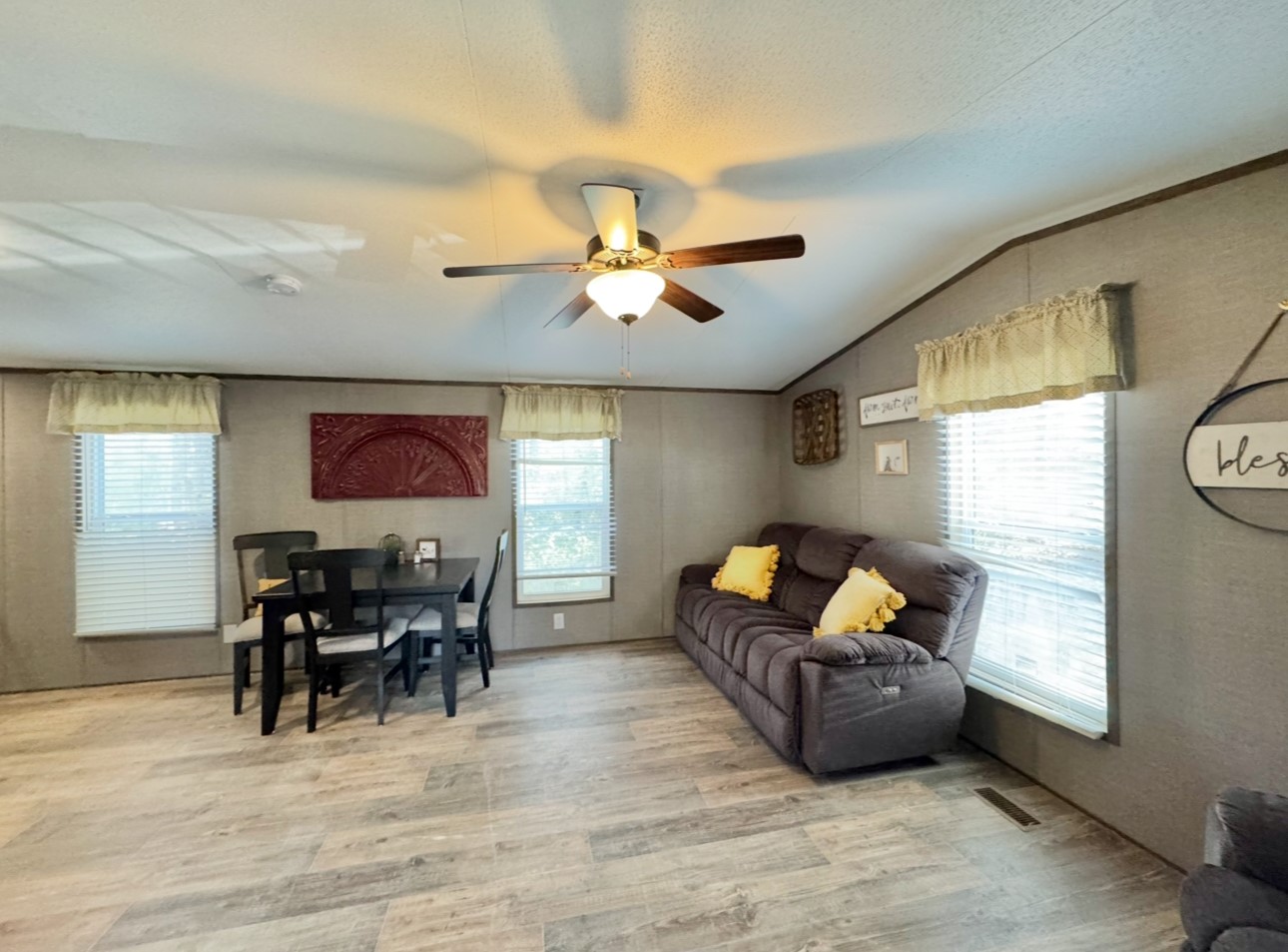 1575 County Rd B Lexington, TX 78947 - Photo 5 of 35 a living room with furniture a dining table and a piano with wooden floor