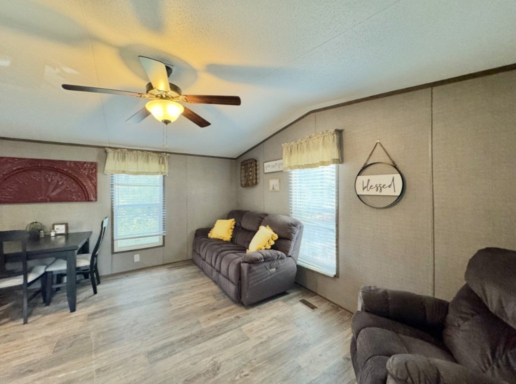1575 County Rd B Lexington, TX 78947 - Photo 6 of 35 a living room with furniture and wooden floor