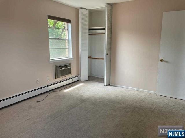 435 Teaneck Road, Unit 19 Ridgefield Park, NJ 07660 - Photo 6 of 7 an empty room with windows and closet