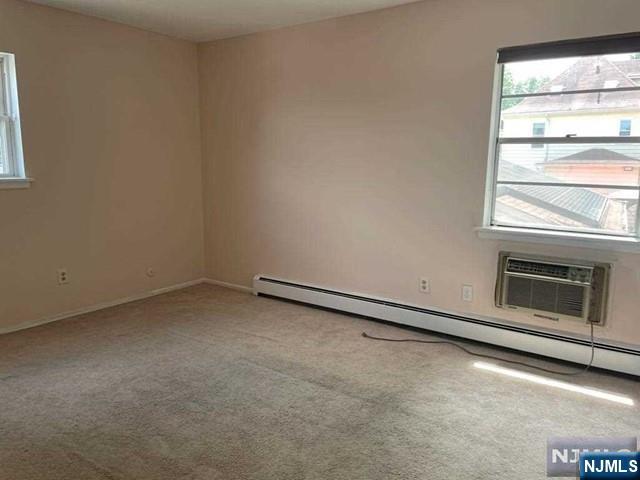 435 Teaneck Road, Unit 19 Ridgefield Park, NJ 07660 - Photo 7 of 7 a view of empty room with a fireplace