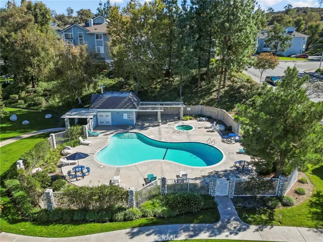 a aerial view of a house with a swimming pool and outdoor space