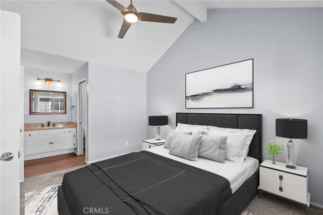 a bedroom with a bed and a night stand