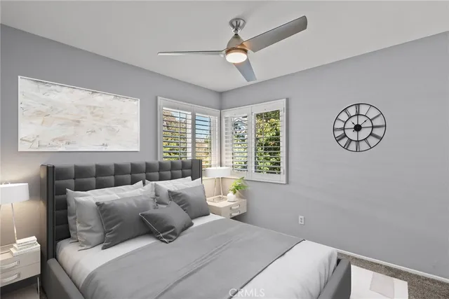 a bedroom with a large bed and a window