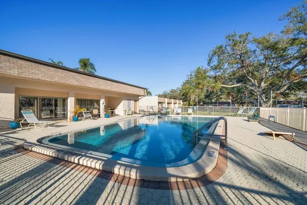 a view of a swimming pool with a patio